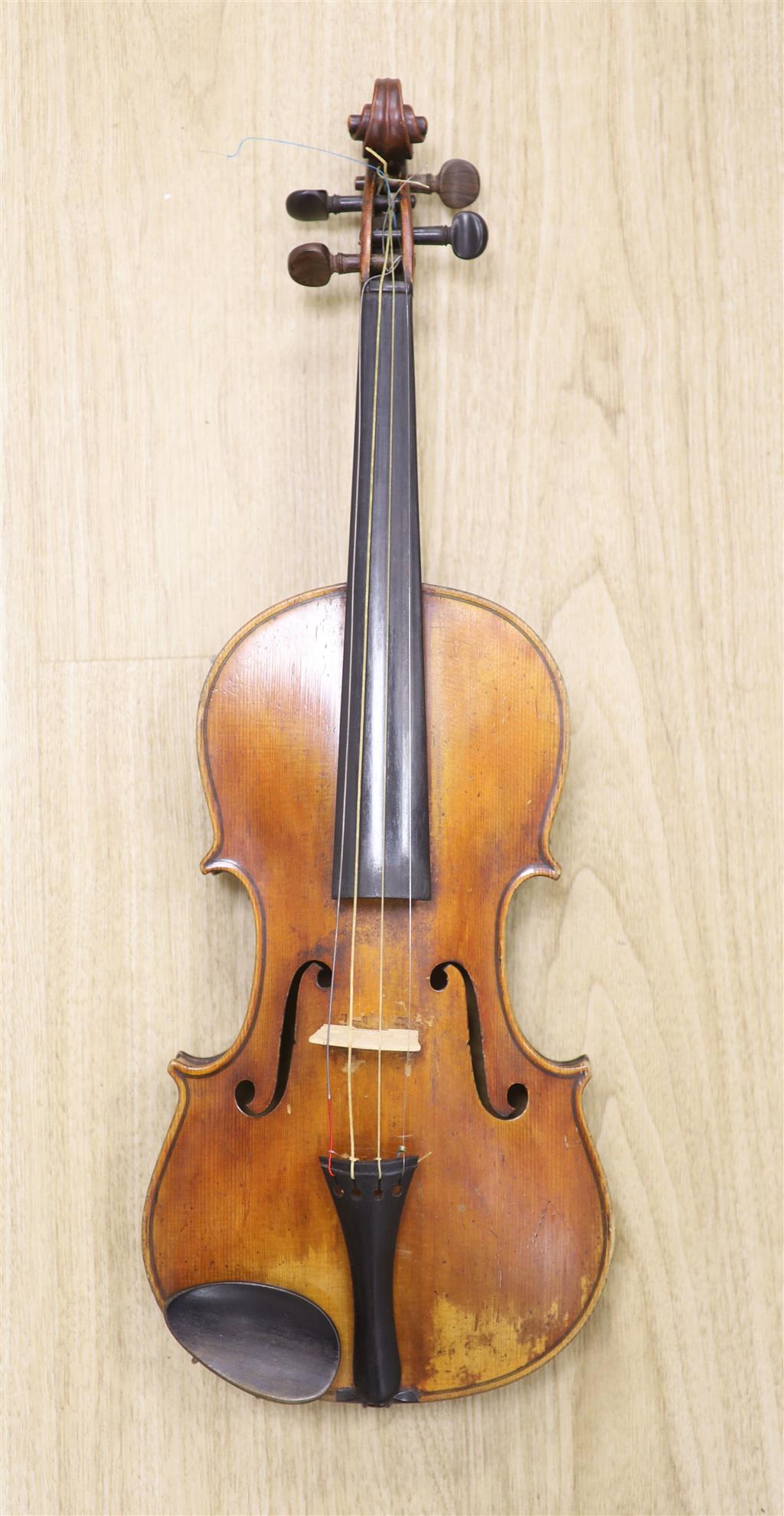 A late 19th century violin and a bow, cased